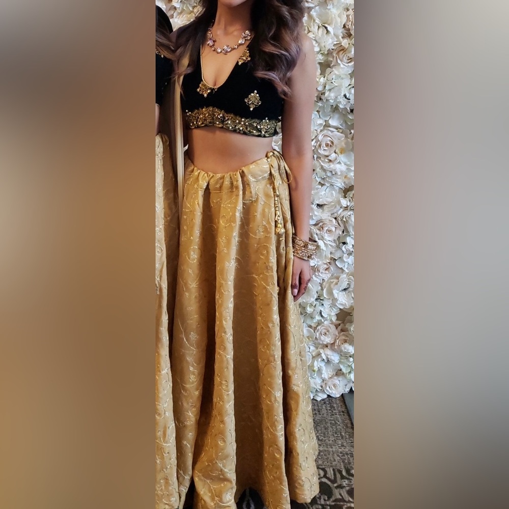 Green velvet with gold embroidery blouse and embroidered gold drawstring skirt.